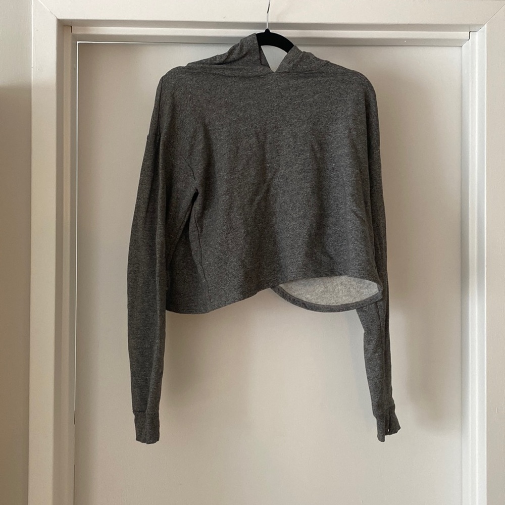 Forever 21 hooded sweatshirt with open back and thumb holes.